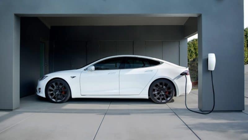 a tesla hooked up to a home charger vancouver