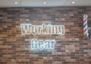 an electric sign displaying the name "Working Gear"