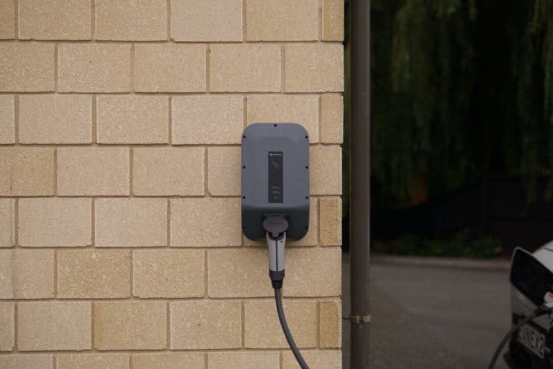 an EV charger installed on the exterior of a home with 200 amp service